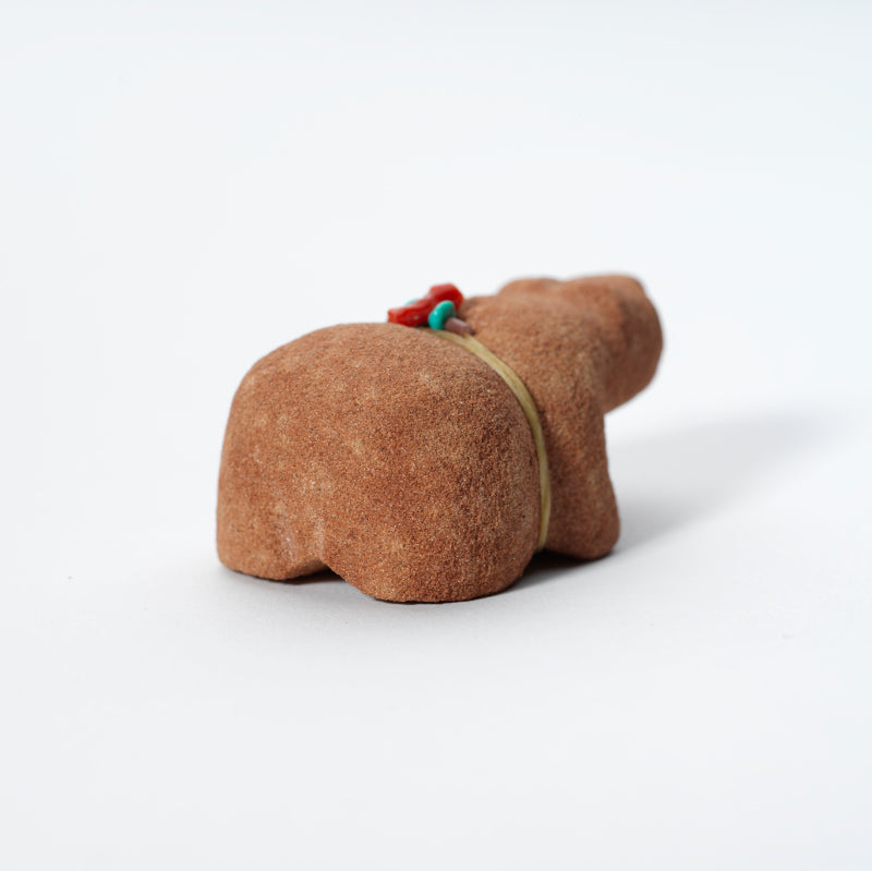 Felino Eriacho: Red Sandstone, Bear with Bundle