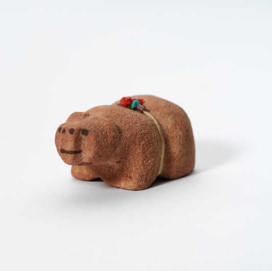Felino Eriacho: Red Sandstone, Bear with Bundle