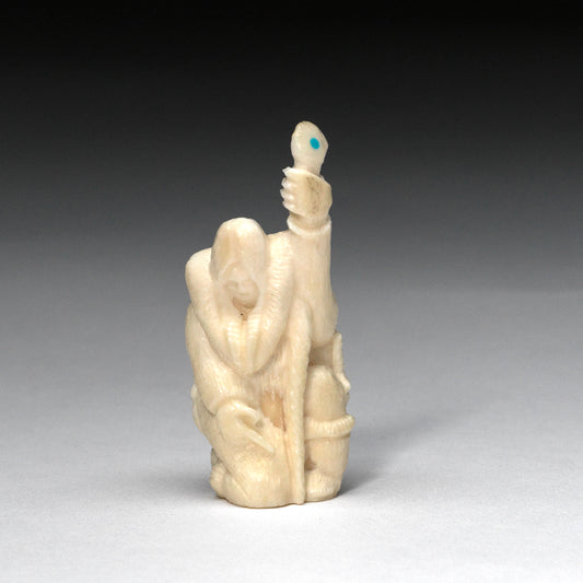 Maxx Laate: Ivory, Fossilized  Kneeling Inuit Figure  a Staff
